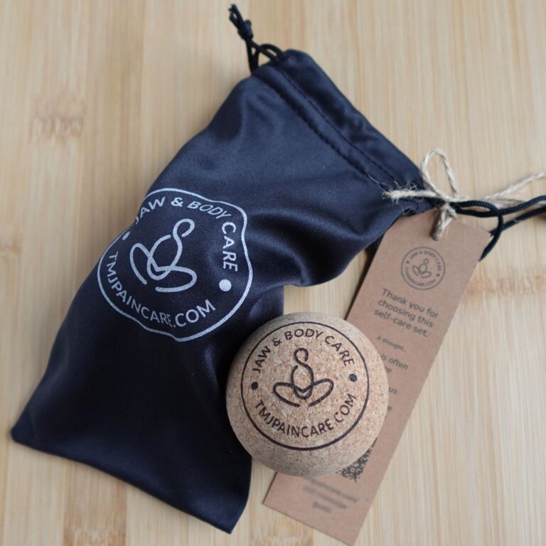 Jaw & Body Care cork massage ball set with pouch and self-care guide tag